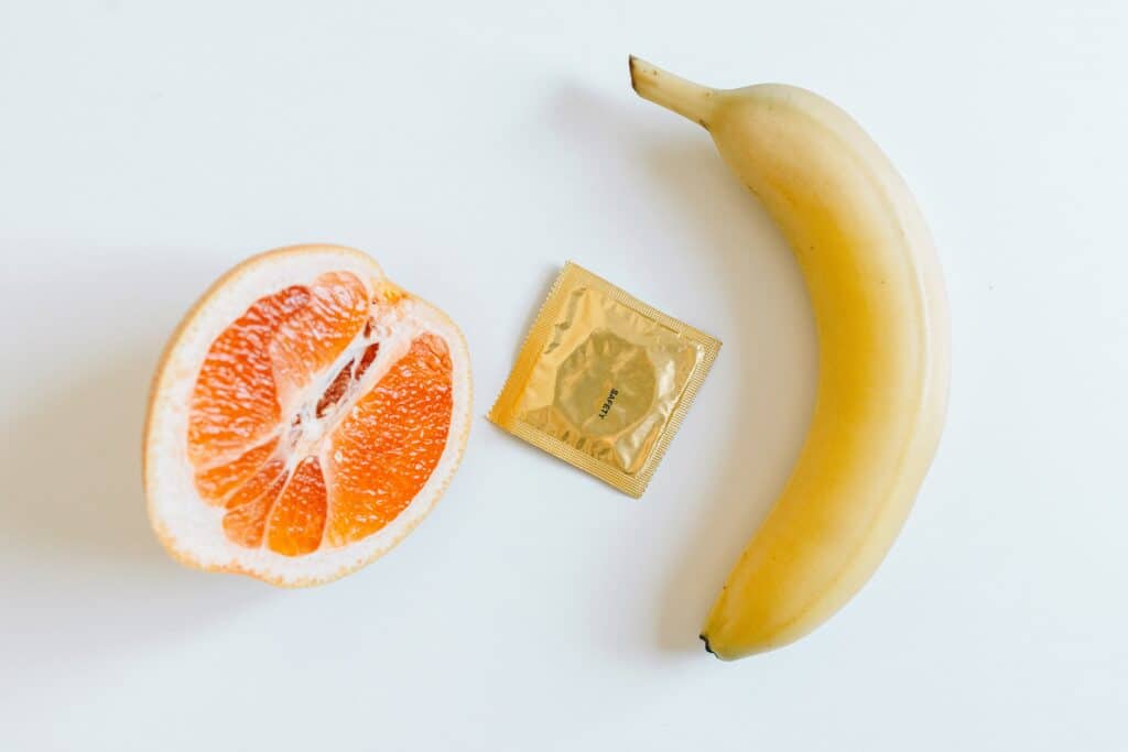 An orange, a banana and a condom